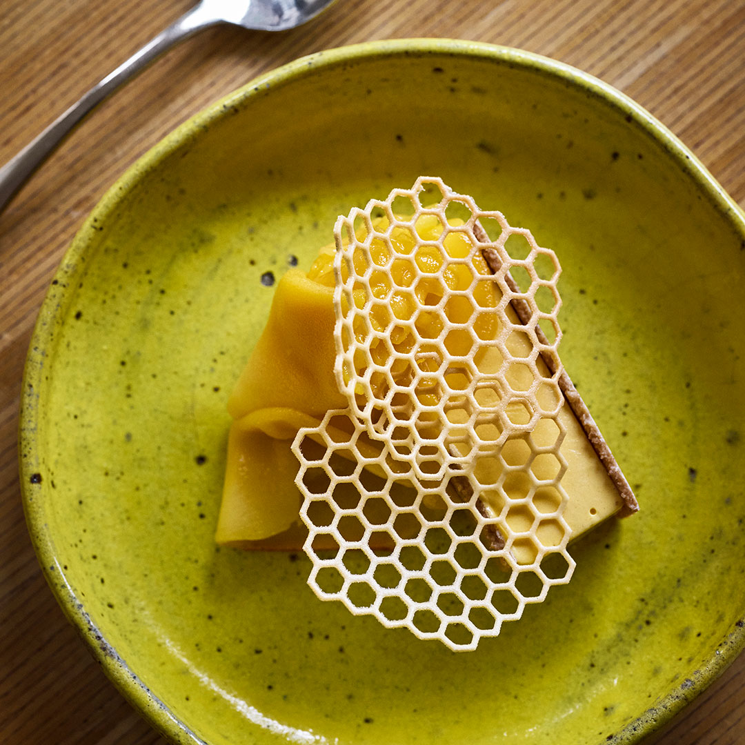 A plate of food with a honeycomb pattern